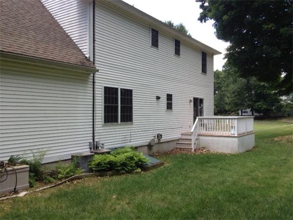 245 Edgell Road Framingham, MA 01701 - Photo 8 of 8 a view of house with backyard and garden