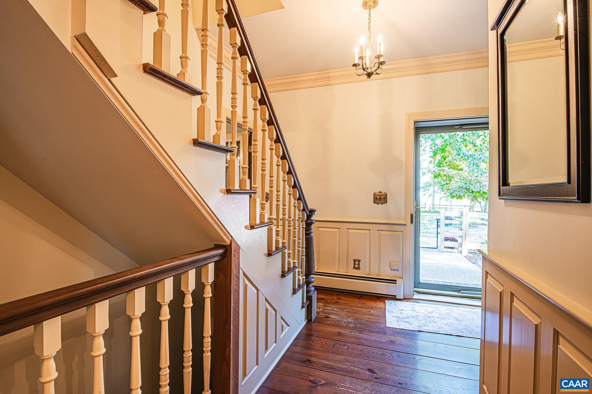 263 Baynes Road Waynesboro, VA 22980 - Photo 11 of 74 a view of a hallway with wooden floors and stairs