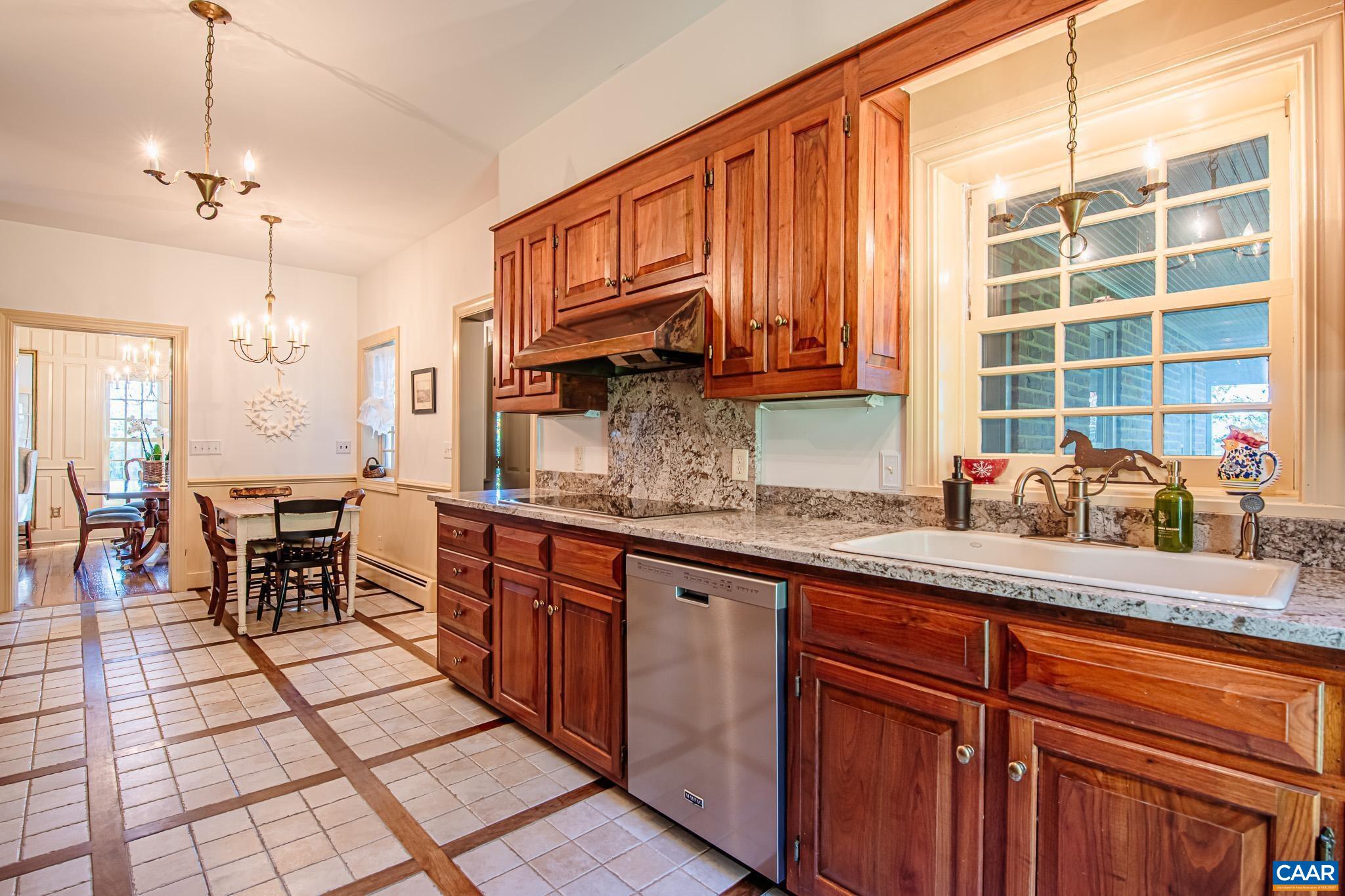 263 Baynes Road Waynesboro, VA 22980 - Photo 16 of 74 a kitchen with stainless steel appliances granite countertop a sink and cabinets