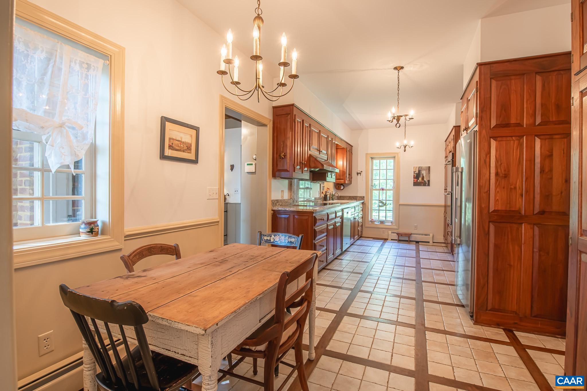 263 Baynes Road Waynesboro, VA 22980 - Photo 19 of 74 a large kitchen with a table and chairs