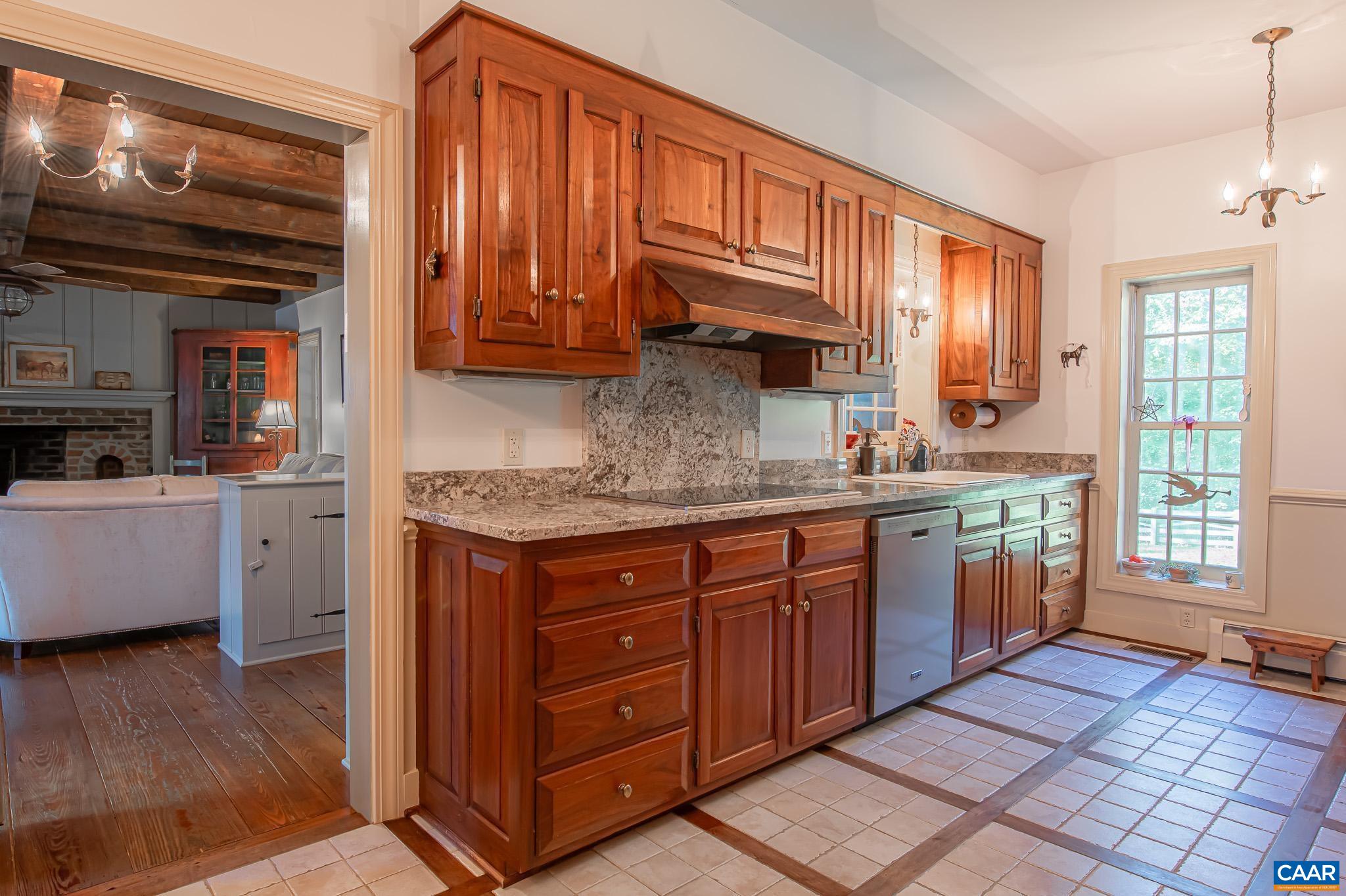 263 Baynes Road Waynesboro, VA 22980 - Photo 22 of 74 a kitchen with stainless steel appliances granite countertop a sink a stove and cabinets