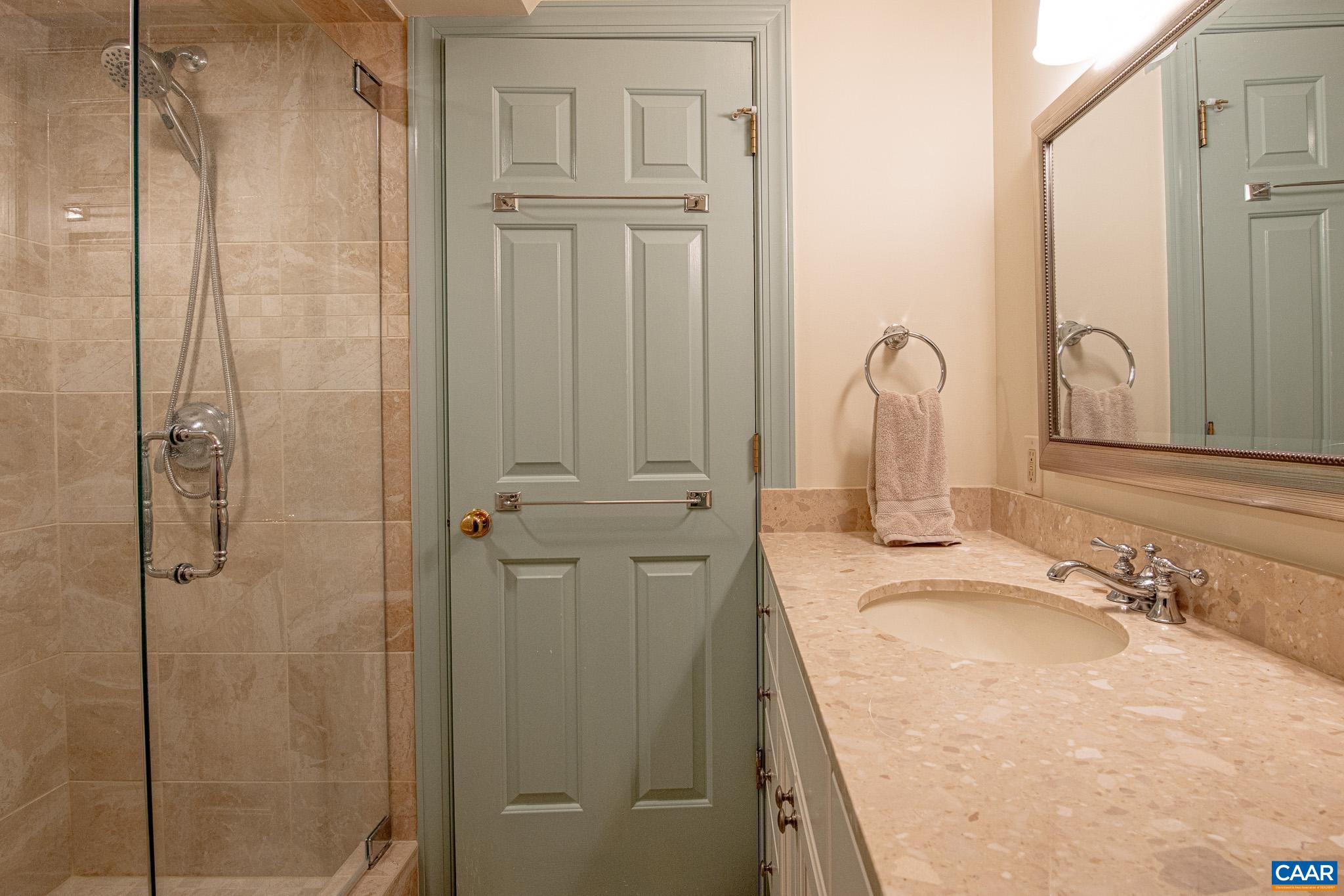 263 Baynes Road Waynesboro, VA 22980 - Photo 42 of 74 a bathroom with a granite countertop sink a mirror and shower