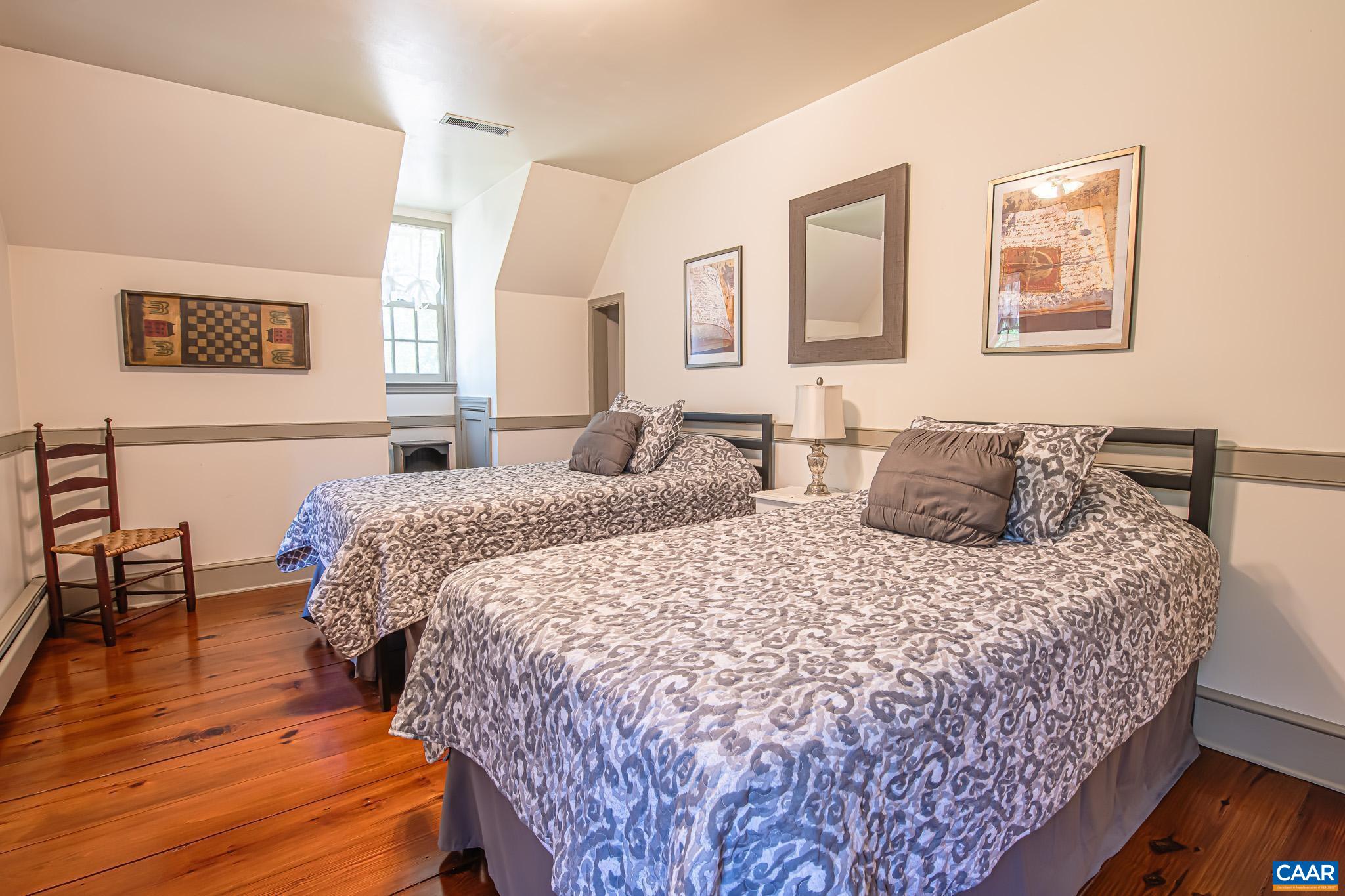 263 Baynes Road Waynesboro, VA 22980 - Photo 44 of 74 a bedroom with bed and wooden floor