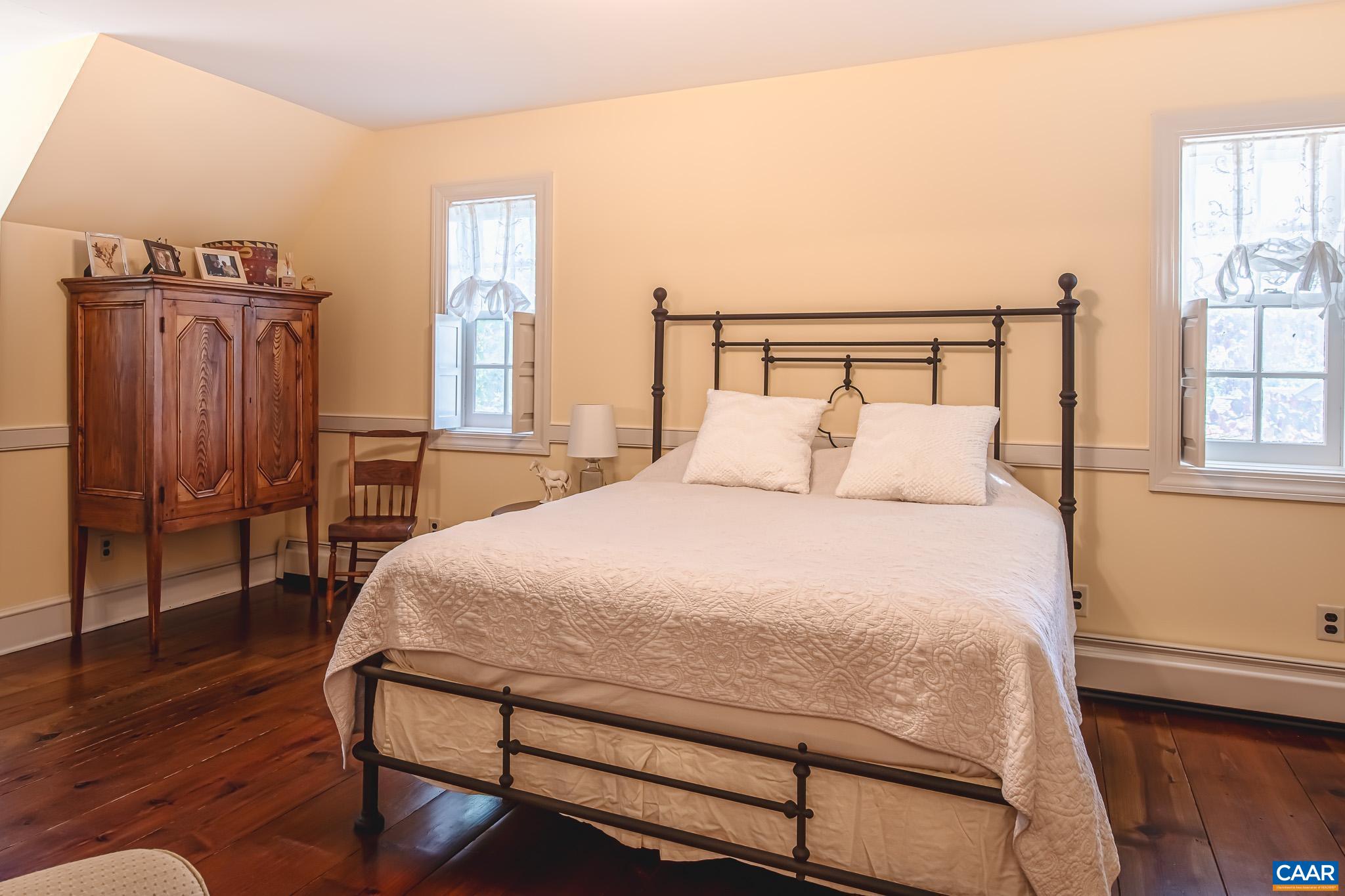 263 Baynes Road Waynesboro, VA 22980 - Photo 46 of 74 a bedroom with a bed a window and chair
