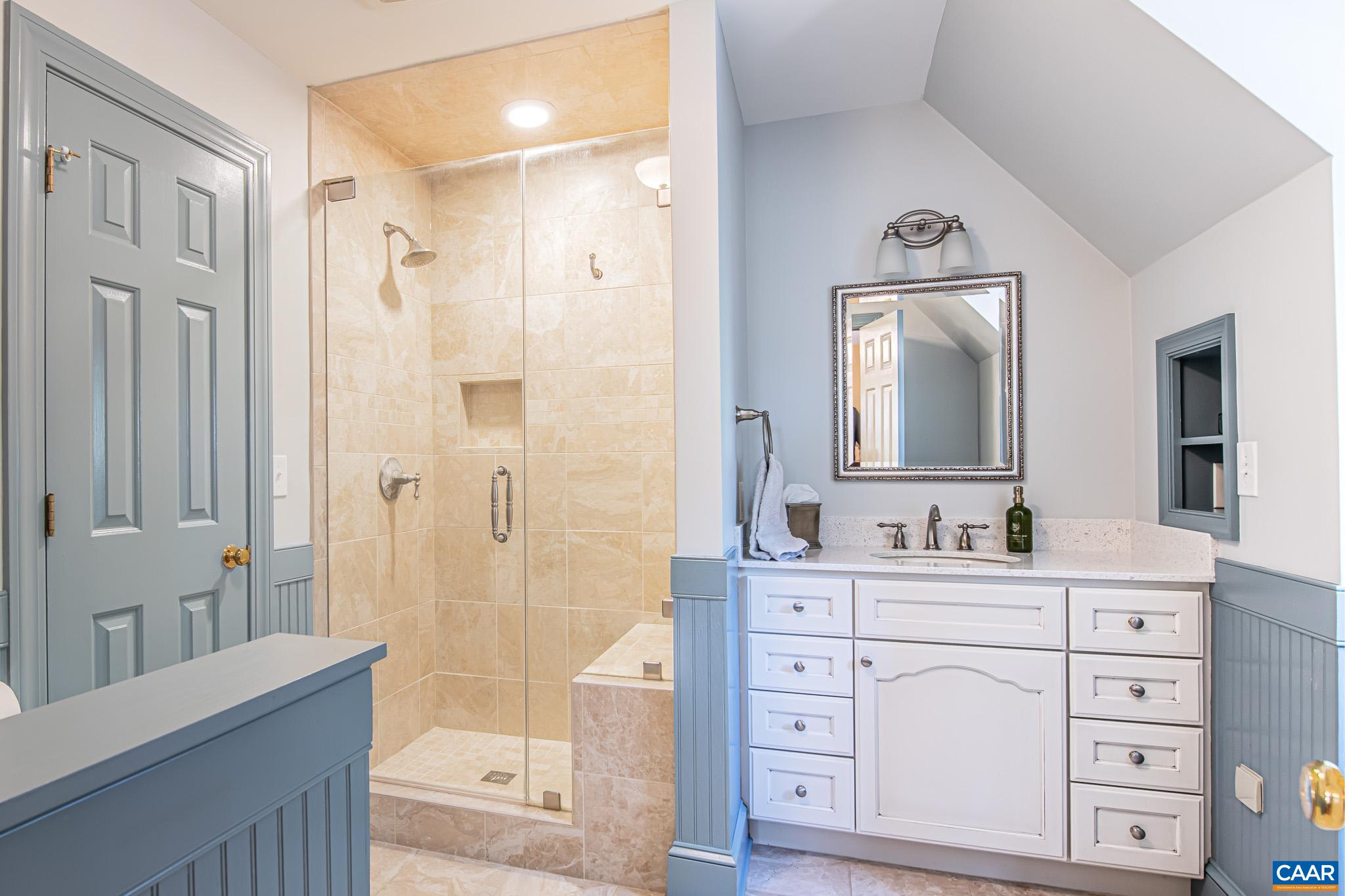263 Baynes Road Waynesboro, VA 22980 - Photo 48 of 74 a bathroom with a double vanity sink mirror and shower