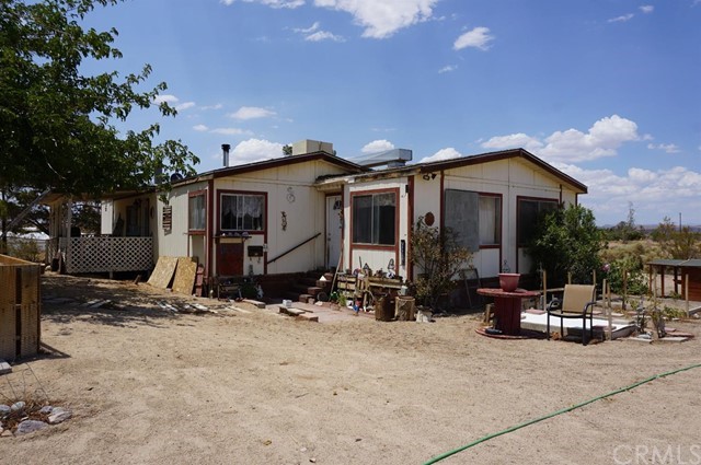 42974 Manatee Street Newberry Springs, CA 92365 - Photo 1 of 20 a view of the house with outdoor seating area