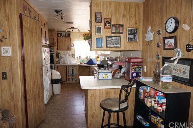 42974 Manatee Street Newberry Springs, CA 92365 - Photo 11 of 20 a view of a workspace with furniture and a window