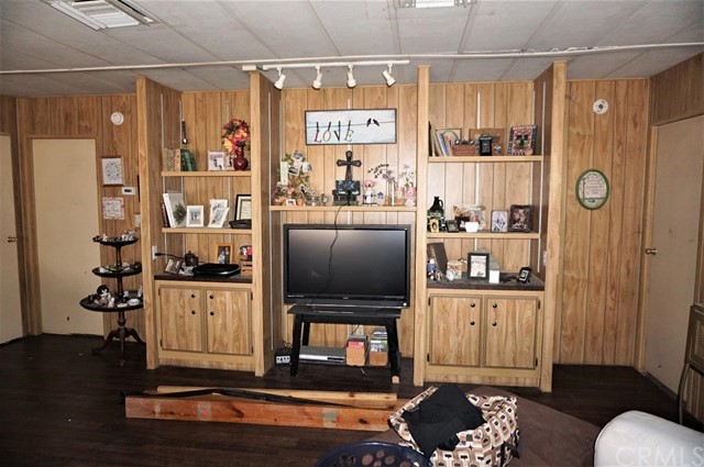 42974 Manatee Street Newberry Springs, CA 92365 - Photo 15 of 20 a living room with furniture and a flat screen tv