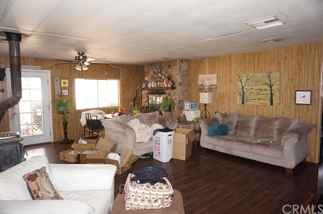 42974 Manatee Street Newberry Springs, CA 92365 - Photo 16 of 20 a living room with furniture and a large window