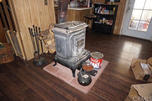 42974 Manatee Street Newberry Springs, CA 92365 - Photo 17 of 20 a living room with furniture and a wooden floor