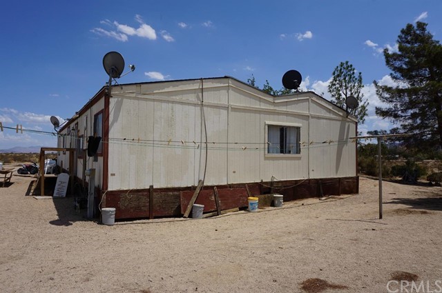 42974 Manatee Street Newberry Springs, CA 92365 - Photo 3 of 20 a view of a house with a snow in the yard
