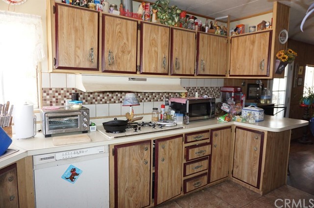 42974 Manatee Street Newberry Springs, CA 92365 - Photo 9 of 20 a kitchen with a sink and cabinets