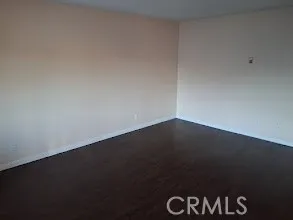 an empty room with a black and white wall