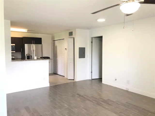 a view of a kitchen with a sink