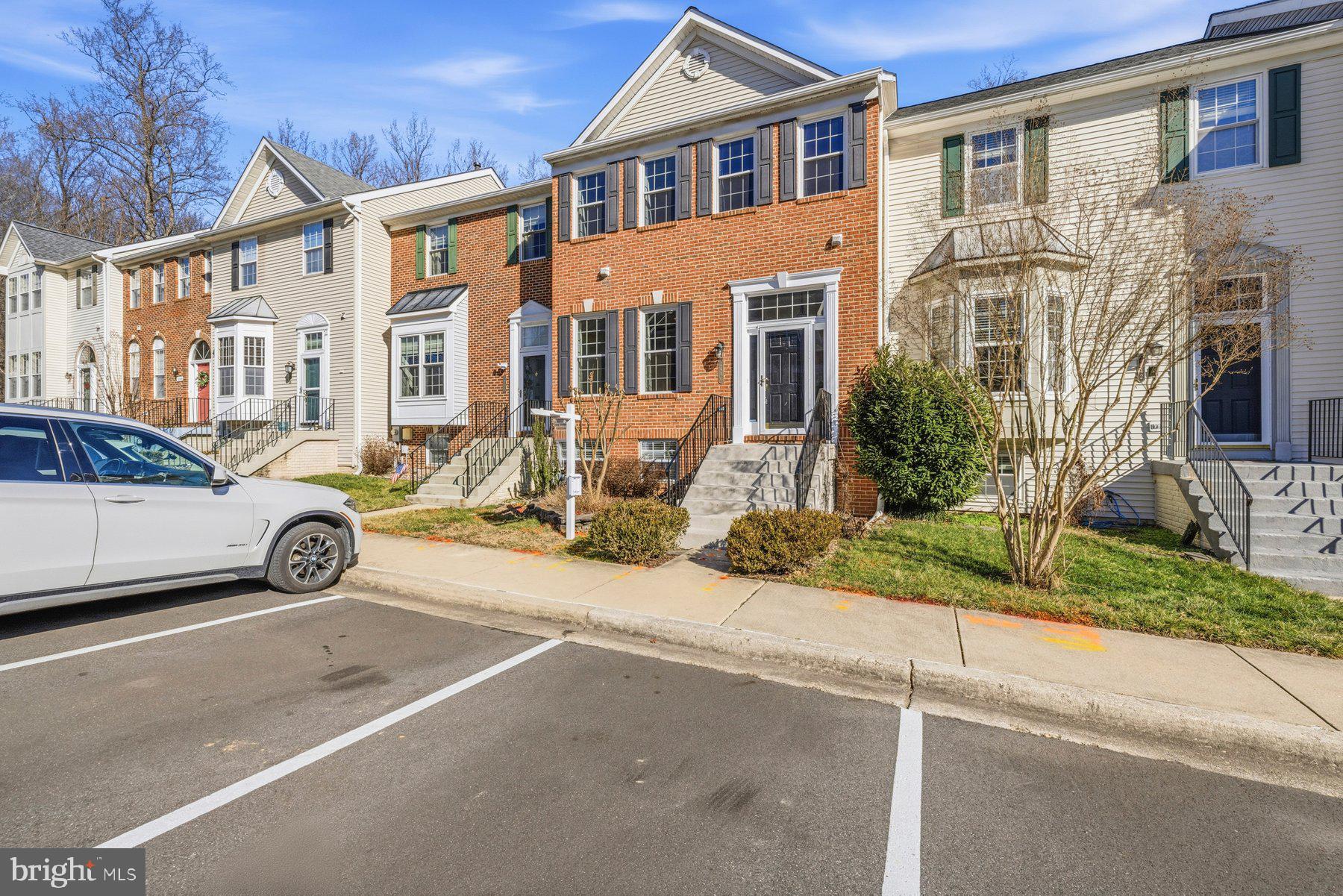 2640 Streamview Drive Odenton, MD 21113 - Photo 2 of 73 a view of a car park in front of a brick house