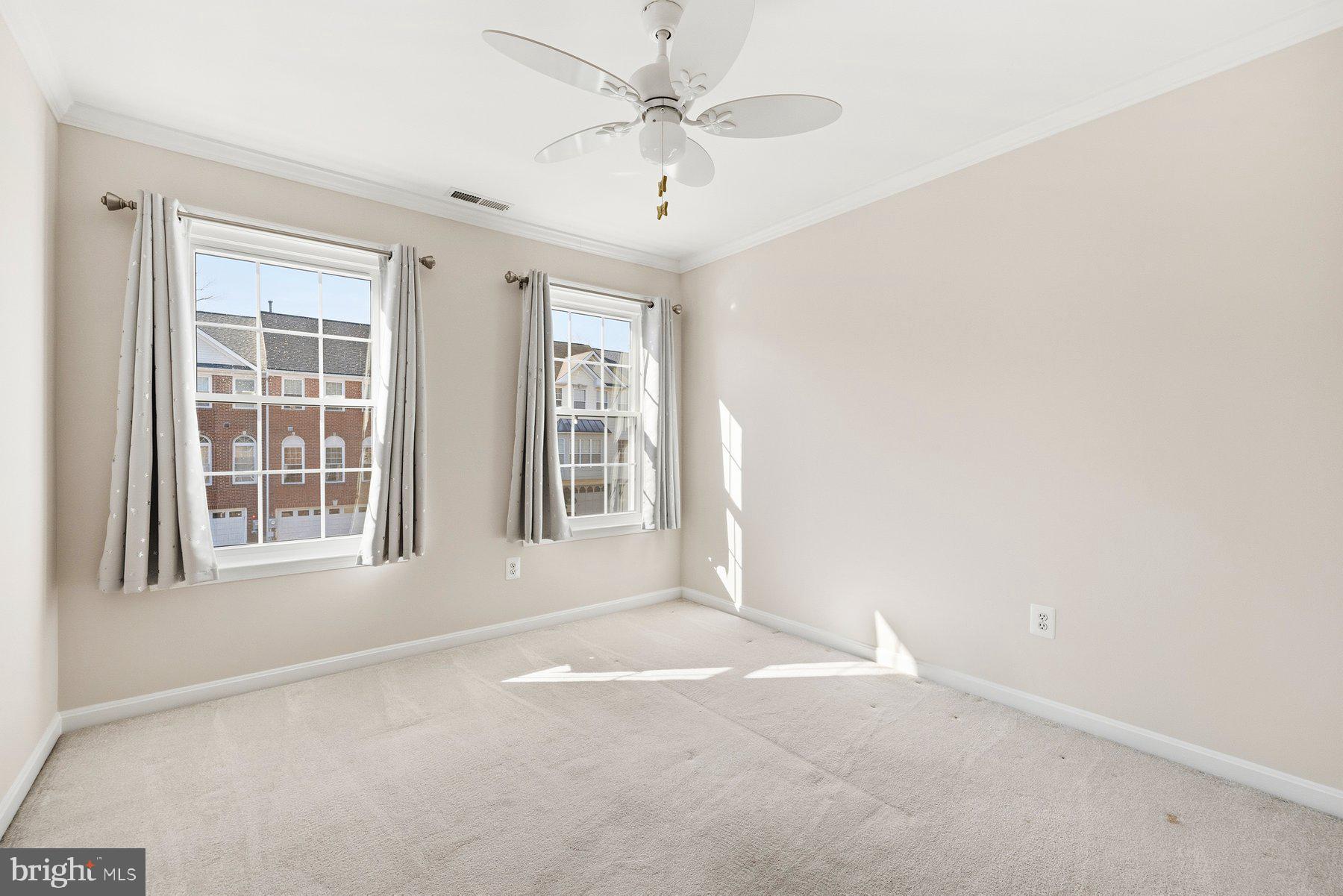 2640 Streamview Drive Odenton, MD 21113 - Photo 28 of 73 an empty room with windows and ceiling fan