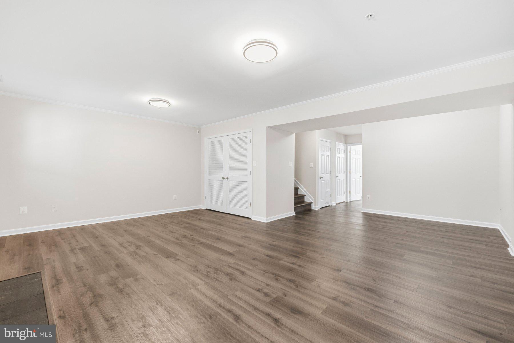 2640 Streamview Drive Odenton, MD 21113 - Photo 34 of 73 a view of an empty room with wooden floor and window