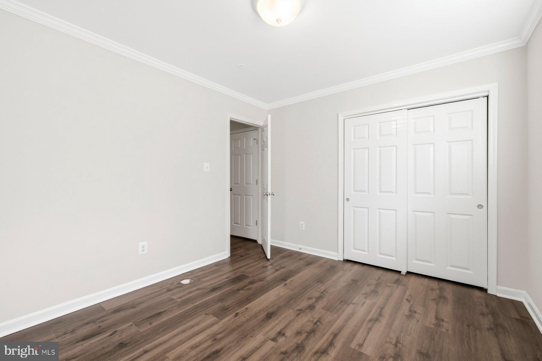 2640 Streamview Drive Odenton, MD 21113 - Photo 41 of 73 a view of an empty room with wooden floor