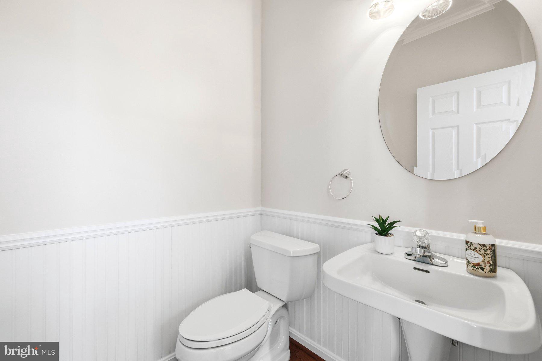2640 Streamview Drive Odenton, MD 21113 - Photo 6 of 73 a bathroom with a sink a toilet and mirror