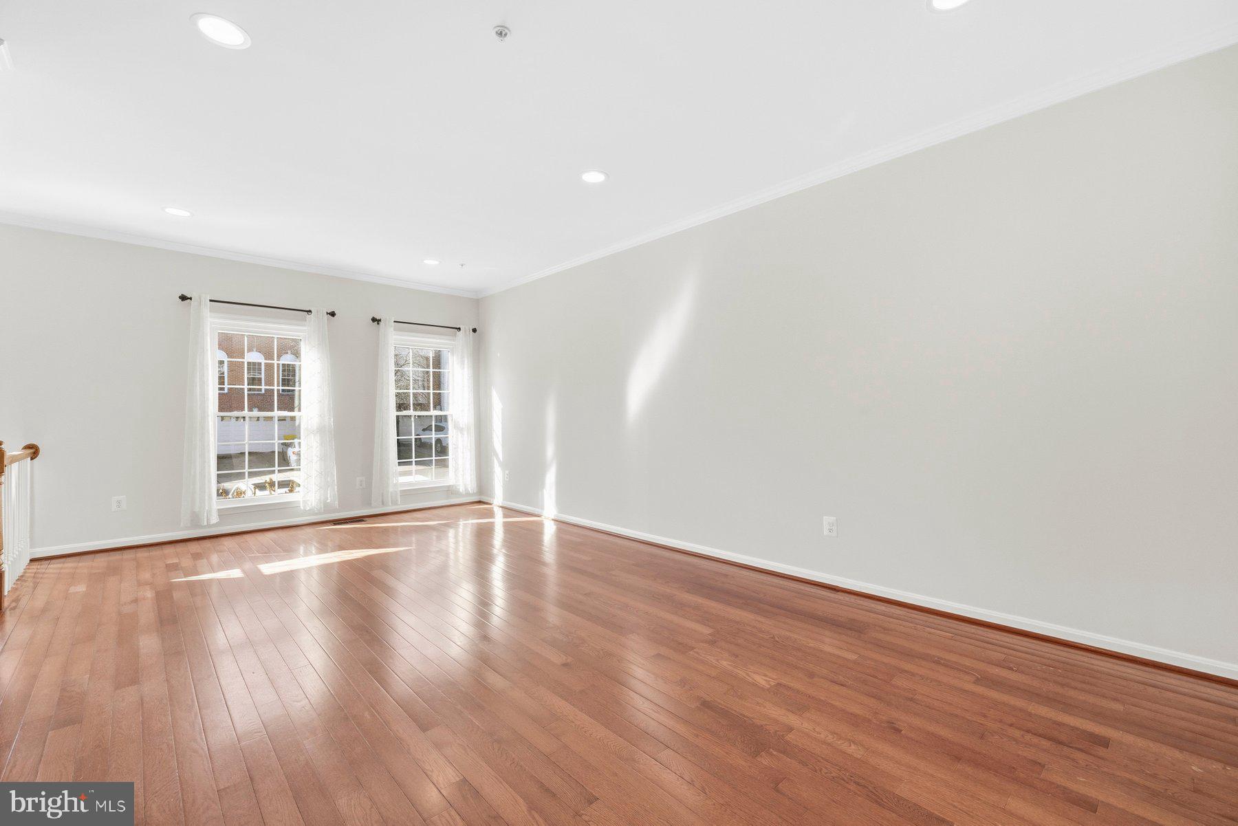 2640 Streamview Drive Odenton, MD 21113 - Photo 8 of 73 a view of an empty room with wooden floor and a window
