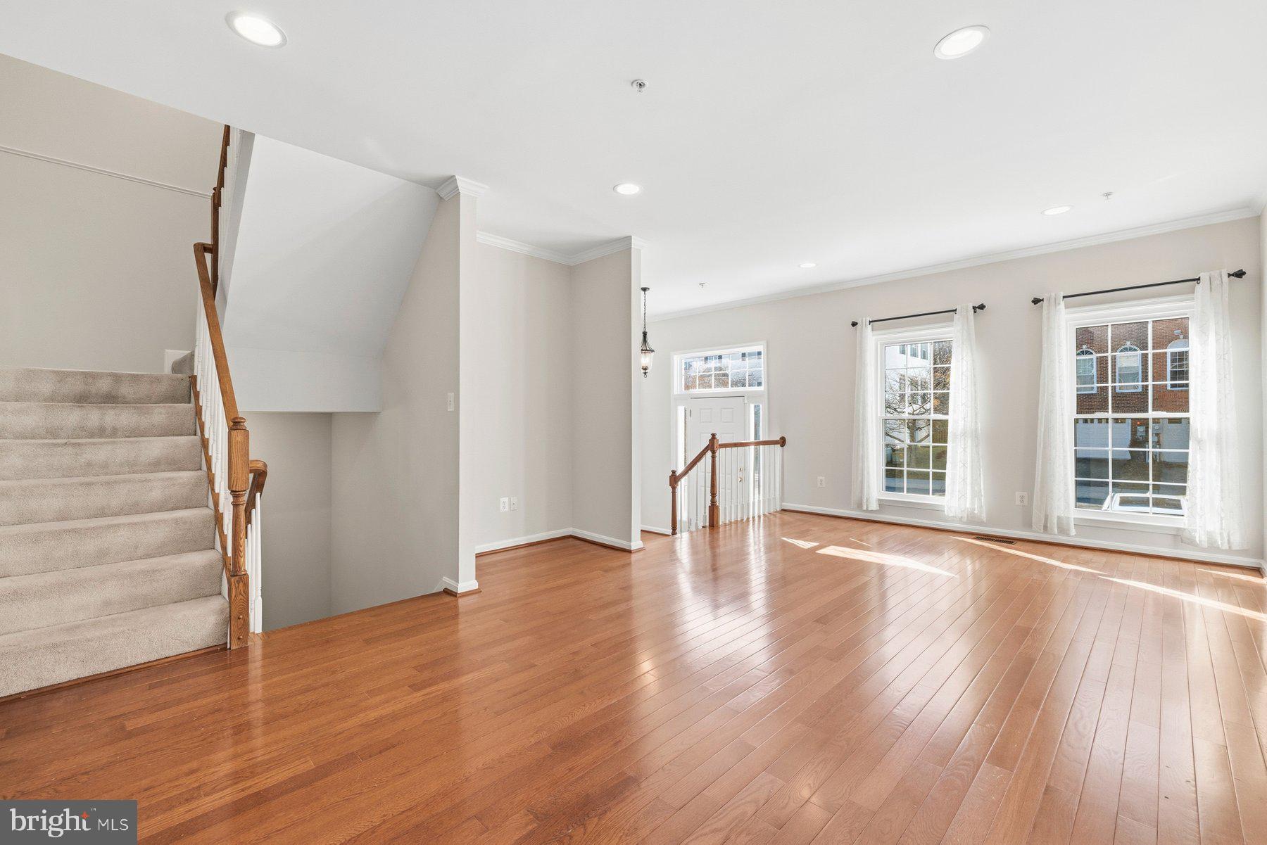 2640 Streamview Drive Odenton, MD 21113 - Photo 9 of 73 a view of an empty room with wooden floor and a window