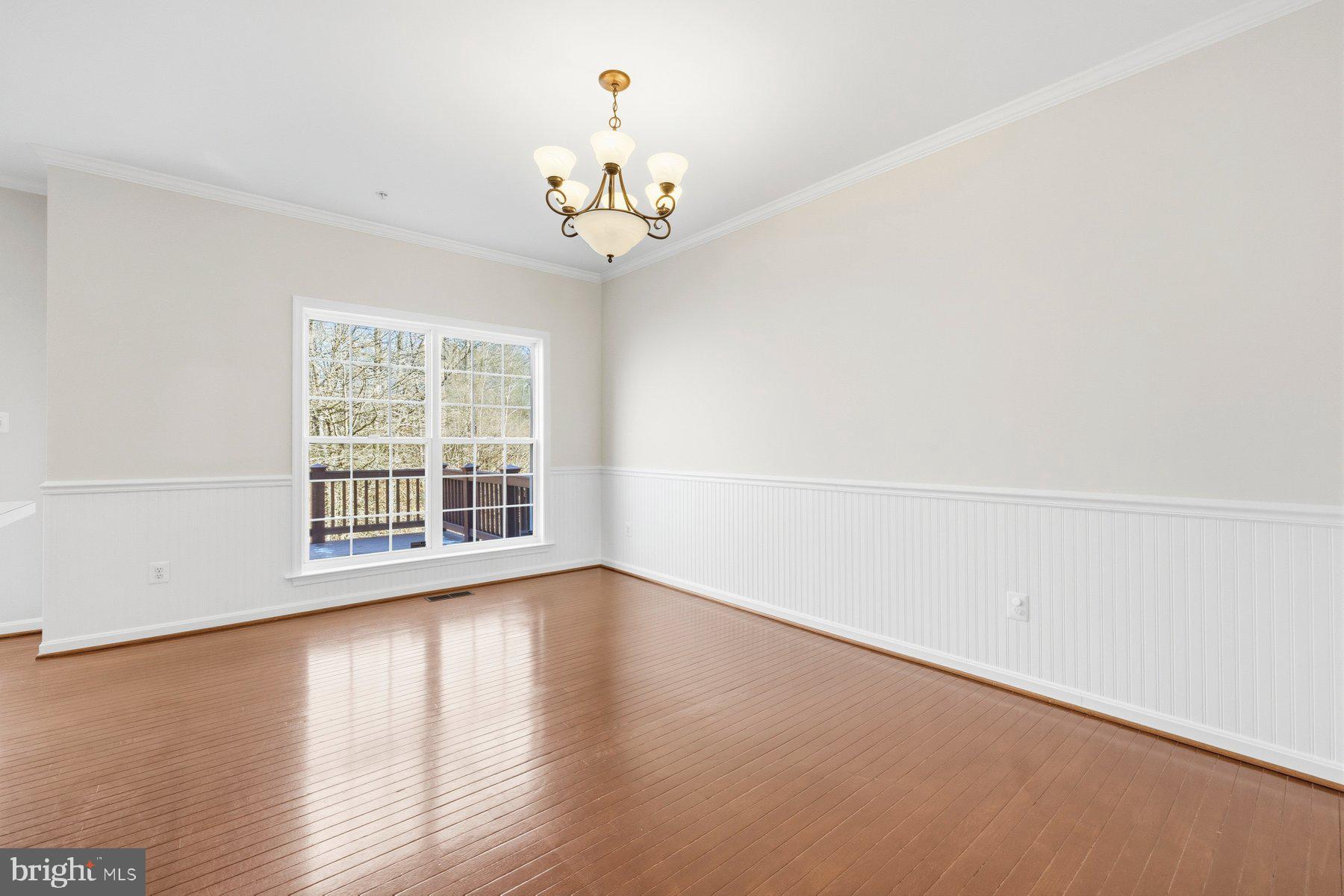 2640 Streamview Drive Odenton, MD 21113 - Photo 10 of 73 a view of an empty room with wooden floor and a window