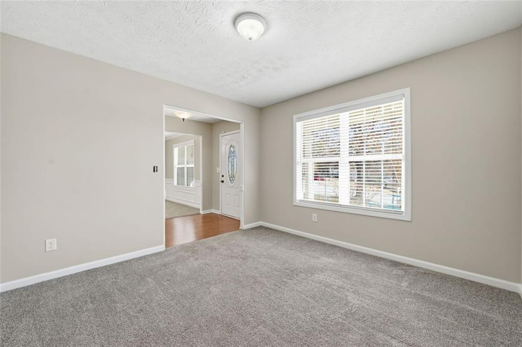 921 Roxeywood Drive Winder, GA 30680 - Photo 15 of 56 a view of an empty room with a window