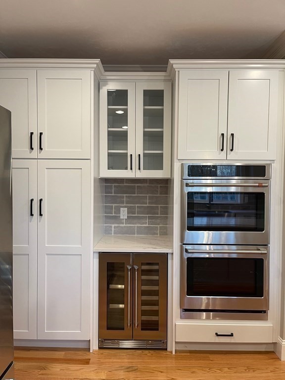 27 Paugus Trail Groton, MA 01450 - Photo 11 of 29 a kitchen with granite countertop white cabinets and stainless steel appliances