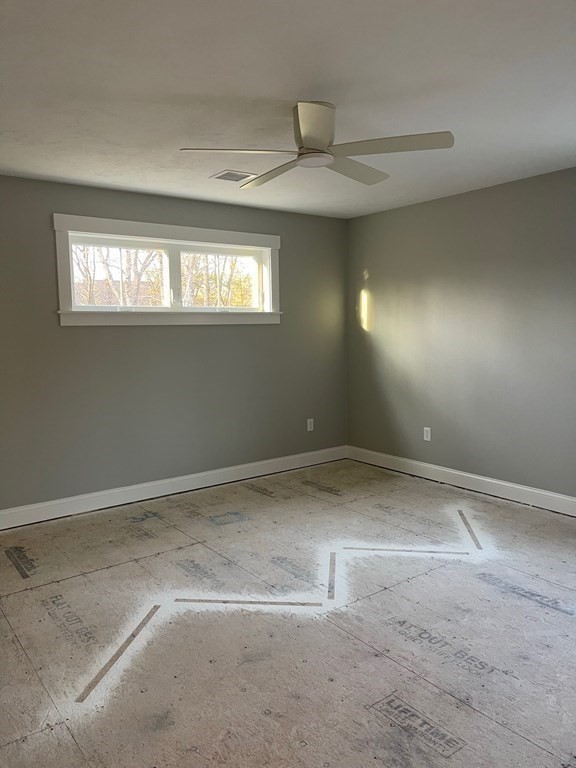 27 Paugus Trail Groton, MA 01450 - Photo 18 of 29 a view of empty room with windows