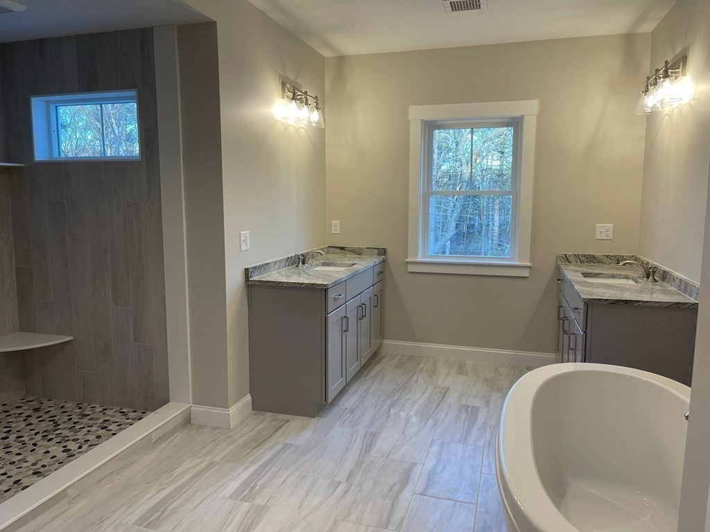 27 Paugus Trail Groton, MA 01450 - Photo 22 of 29 a bathroom with a sink a toilet and vanity