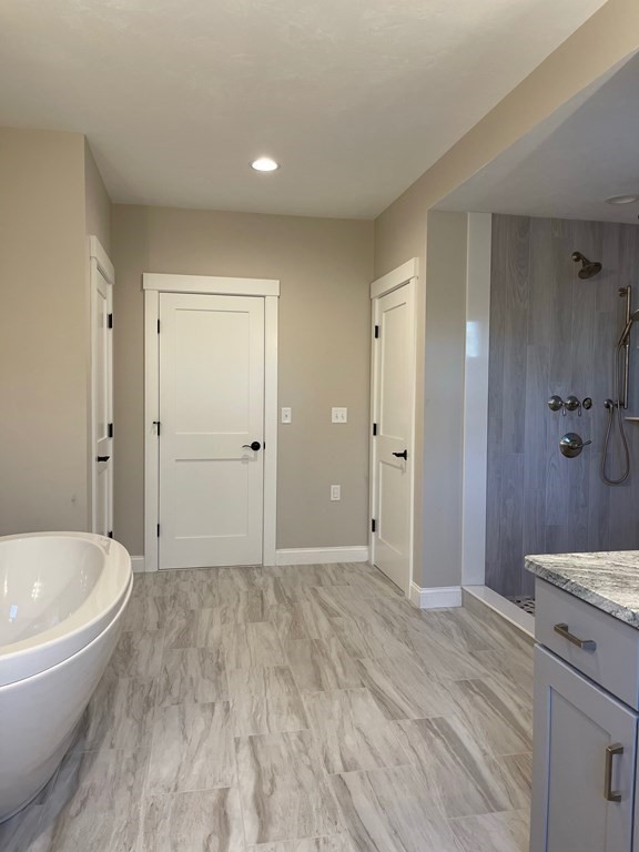 27 Paugus Trail Groton, MA 01450 - Photo 24 of 29 a view of a bathroom with sink bathtub and shower