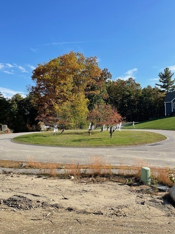 27 Paugus Trail Groton, MA 01450 - Photo 28 of 29 a view of a lake with a nearby beach