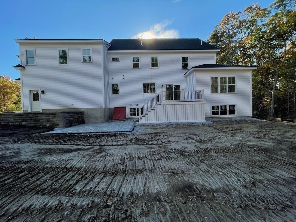 27 Paugus Trail Groton, MA 01450 - Photo 4 of 29 a front view of a house with a yard
