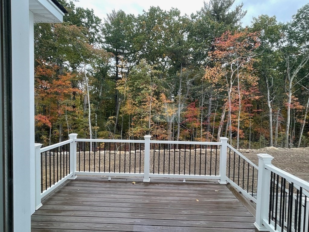 27 Paugus Trail Groton, MA 01450 - Photo 5 of 29 a view of a wooden roof deck