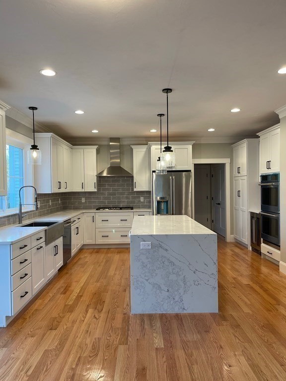 27 Paugus Trail Groton, MA 01450 - Photo 8 of 29 a large kitchen with granite countertop a large counter top stainless steel appliances and cabinets