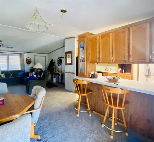 a dining room with furniture and a window