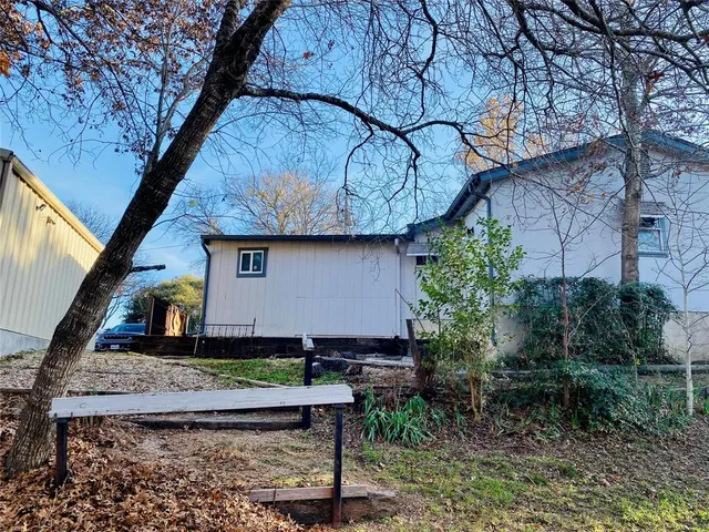 a bedroom with bed and a chandelier