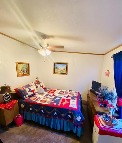 a view of a porch with furniture and garden