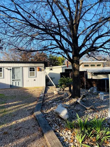 a view of a house with a yard and garage