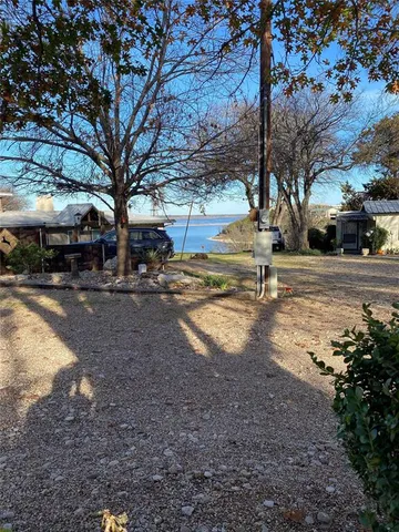 a view of a yard with trees