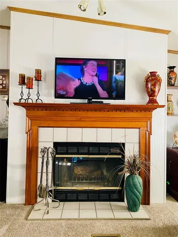 a view of fireplace and living room