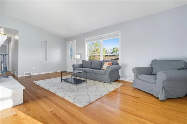 a kitchen with granite countertop a sink stainless steel appliances and cabinets