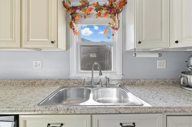 a view of a dining room with furniture wooden floor and a chandelier