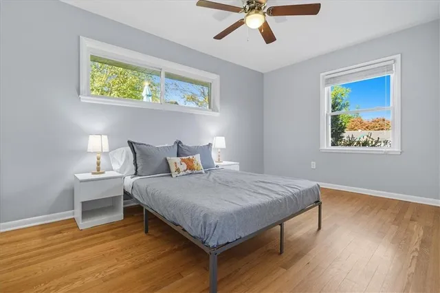a bathroom with a tub a sink and mirror