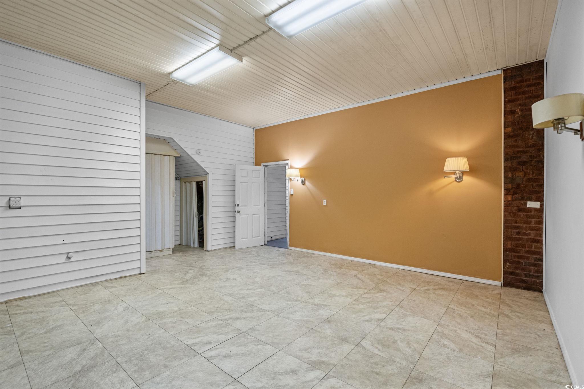 6912 Bay Road Myrtle Beach, SC 29588 - Photo 26 of 38 Unfurnished room featuring wood ceiling and wood walls