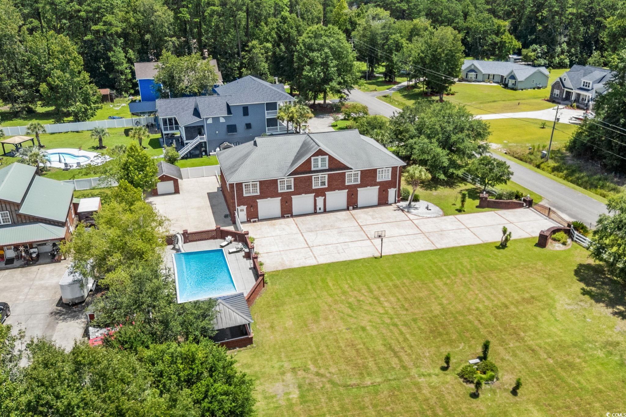 6912 Bay Road Myrtle Beach, SC 29588 - Photo 28 of 38 Aerial view of residential area with a pool area