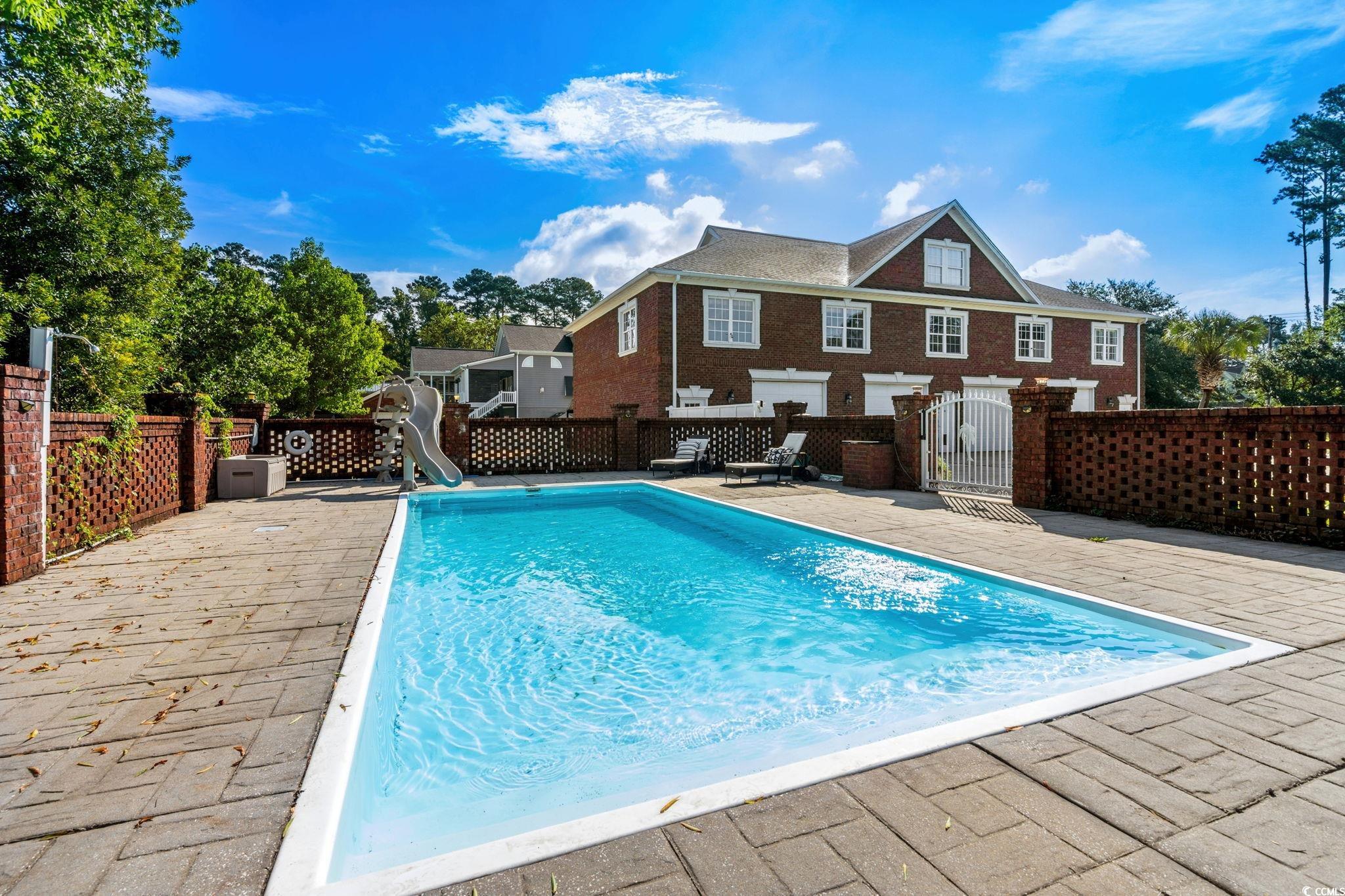 6912 Bay Road Myrtle Beach, SC 29588 - Photo 32 of 38 View of swimming pool featuring a water slide