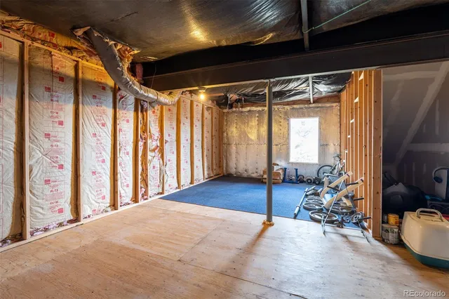 a room with lots of furniture and a window