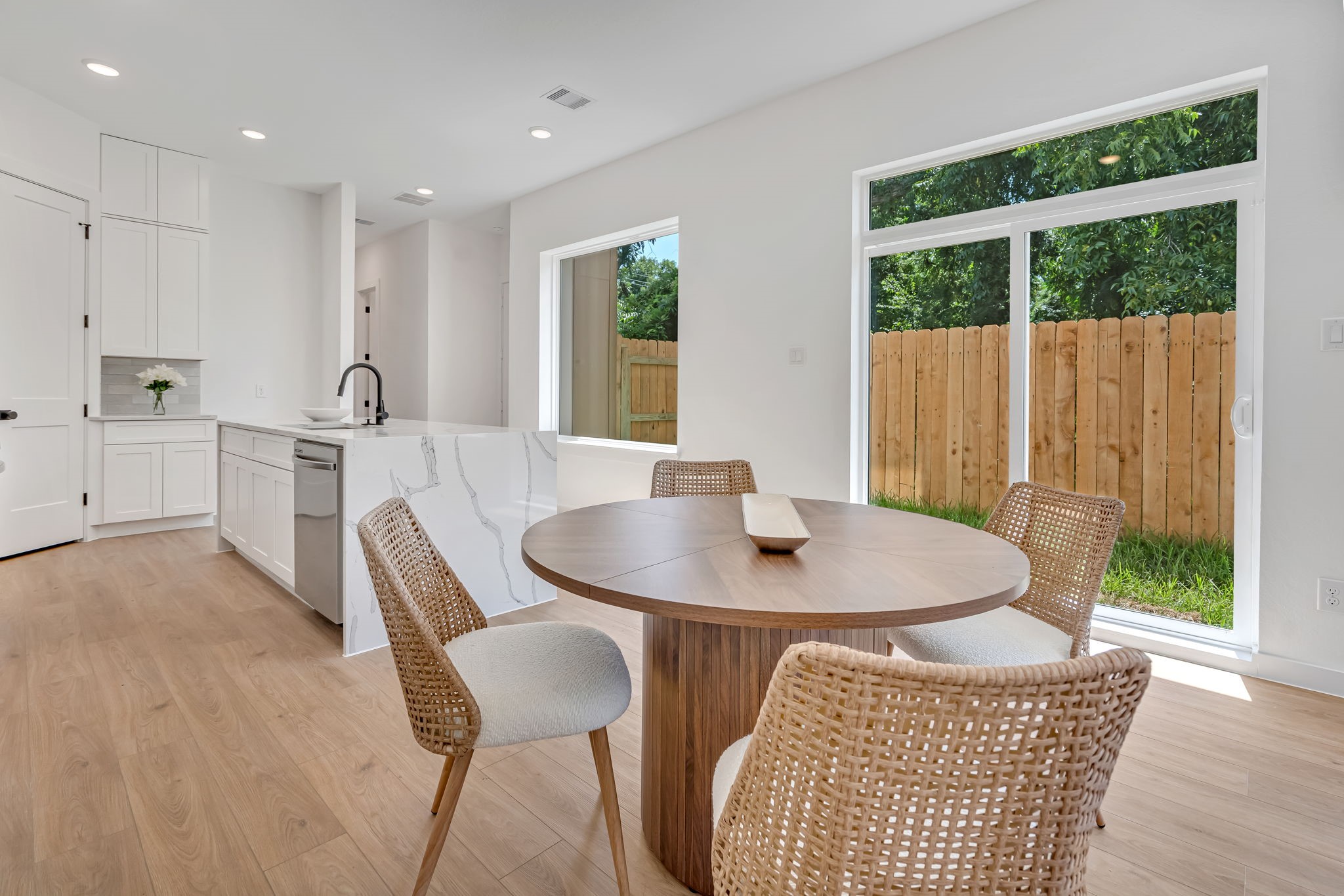 3620 Sauer Street, Unit B Houston, TX 77004 - Photo 5 of 31 a view of a dining room with furniture window and wooden floor