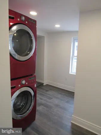 a view of a hallway with washer and dryer